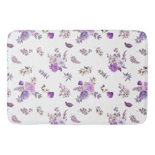 Mooie paarse bloemen op badmat
