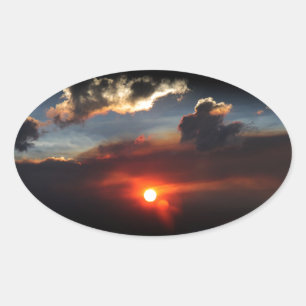 mooie rokerige zonsondergang foto ovale sticker