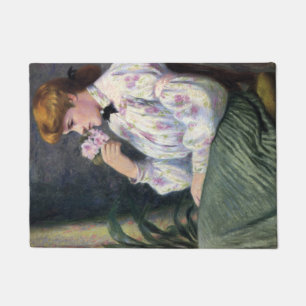 Mooie vrouw die bloemen geur ruikt (Reverie) Deurmat