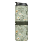 Mooie weide bloemen op groen thermosbeker (Geroteerd rechts)