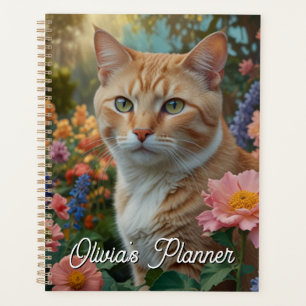 Mooie witte oranje kat in bloementuin planner