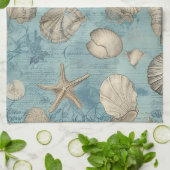 Mooie  zeeschelpen in blauw theedoek (Gevouwen)