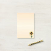 Mooie zonnebloem op koraal post-it® notes (Op bureau)