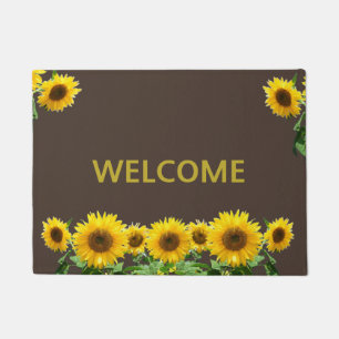 Mooie zonnebloemen op bruine welkomstmat deurmat