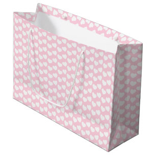 Motif blanc de coeur sur le grand sac rose-clair