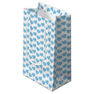 Motif bleu-clair de coeur sur le petit sac blanc