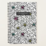 Motif coloré noir   blanc marguerites<br><div class="desc">Motif avec illustrations de marguerites noires et blanches aux centres colorés en jaune,  rose et bleu.</div>