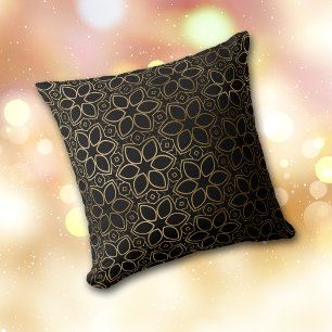 Motif de fleur d'or sur oreiller à lancer noir