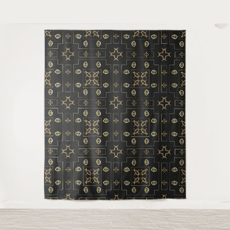 Motif d'œil en or antique sur tapisserie noire