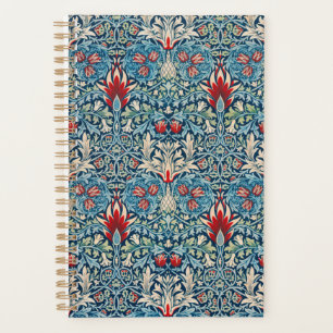 Motif floral sur fond bleu de feuilles vertes