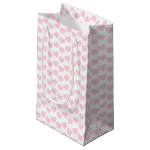 Motif rose-clair de coeur sur le petit sac blanc