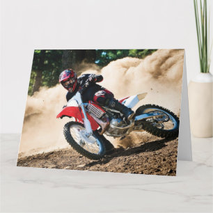 Motocross rijder gooit kussen kaart