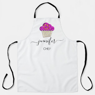 Muffins bakkerij-koeken die de gouden roze koker s schort