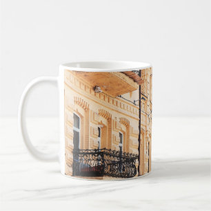 Mug À old yellow house with wrought-iron balconies. f