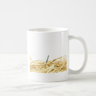 Mug aiguille dans une meule de foin