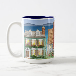Mug avec de belles maisons à l'air sur la plage