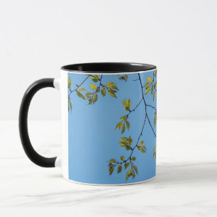 Mug beautiful branch with green and yellow leaves hug