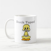 Mug Canard de jaune d'humour de ruban adhésif attaché (Gauche)