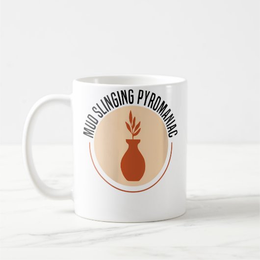 Mug Céramique de poterie pyromane qui lance de la boue (Gauche)