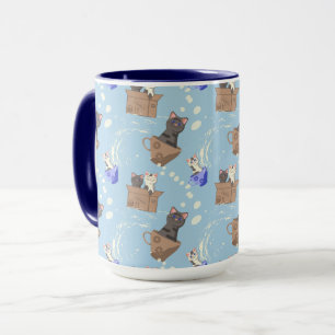 Mug Chats dans une boîte et gouttes de lait sur fond b