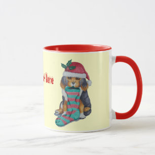 Mug chiot noir et brun mignon avec le bas de Noël