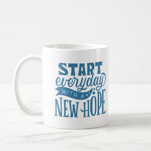 MUG COMMENCEZ TOUS LES JOURS AVEC UN NOUVEL ESPOIR (Gauche)