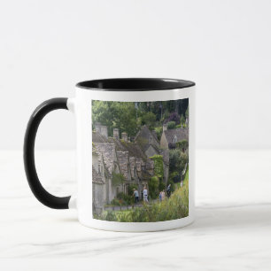 Mug cottages en pierre de Cotswold dans le village de