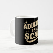 Mug Devenir adulte est une arnaque (Devant gauche)