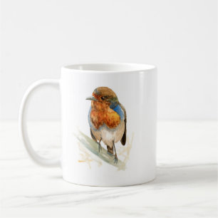 Mug en céramique avec un rouge-gorge regardant à d