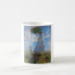 Mug Femme avec Parasol, Monet<br><div class="desc">Oscar-Claude Monet (14 novembre 1840 - 5 décembre 1926) était un peintre français, un fondateur de la peinture impressionniste française et le praticien le plus constant et le plus prolifique de la philosophie du mouvement d'exprimer ses perceptions avant la nature, surtout en ce qui concerne la peinture en plein air...</div>