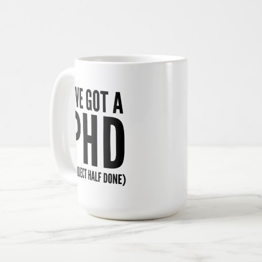 Mug J'ai un PHD (projet à moitié terminé) (Devant gauche)