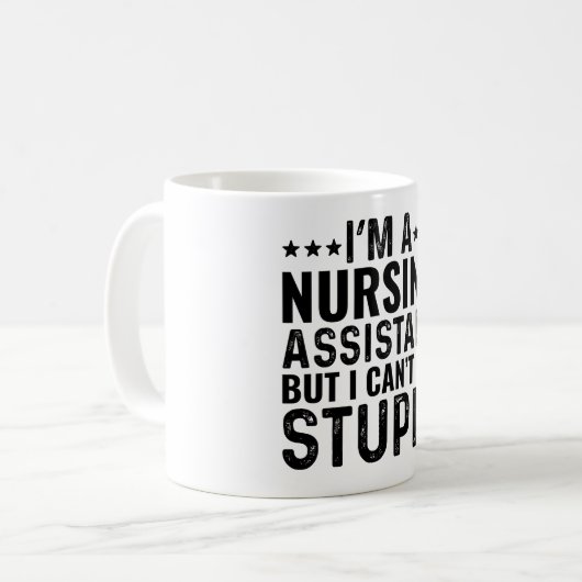 Mug Je suis une assistante en soins infirmiers, mais j (Devant gauche)