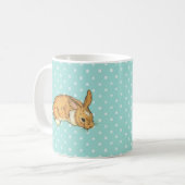 Mug lapin de bébé sur l'arrière - plan turquoise de (Devant gauche)