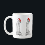 Mug New York Christmas NYC Skyscraper Santa Claus Casq<br><div class="desc">Mug présente une illustration originale d'un gratte-ciel classique de New York,  "habillé" pour Noël avec un casquette du Père Noël rouge. Ne vois-tu pas ce que tu cherches ? Vous avez besoin d'aide pour la personnalisation ? Contactez Rebecca pour avoir quelque chose conçu pour vous.</div>