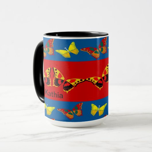 Mug papillon en bleu, jaune et rouge (Devant gauche)