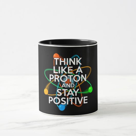 MUG PENSEZ COMME UN PROTON ET RESTEZ POSITIF (Centre)