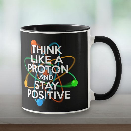 MUG PENSEZ COMME UN PROTON ET RESTEZ POSITIF