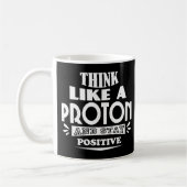 Mug Pensez comme un proton et restez positif (Gauche)
