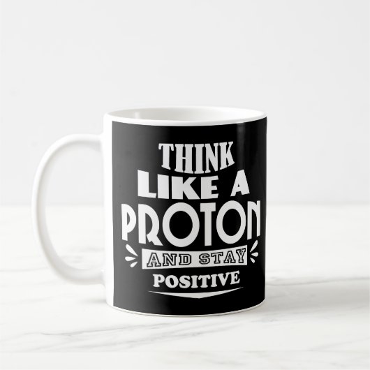 Mug Pensez comme un proton et restez positif (Gauche)