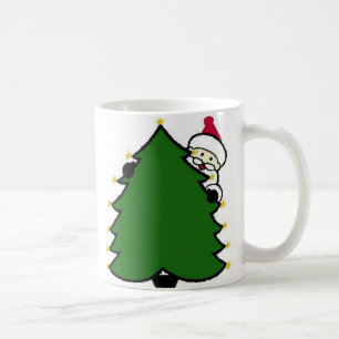Mug père Noël se cache derrière l'arbre de Noël