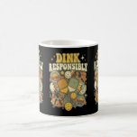 Mug Pickleball Dink Responsibly Paddle Player<br><div class="desc">This funny retro pickleball design features a bootleg 70s vintage design with pickleball paddles,  balls,  and the hilarious phrase “Dink Responsibly.” Perfect for pickleball players who love classic retro style,  this groovy coffee mug or tea cup makes a great gift for pickleball fans,  league players,  and weekend court warriors.</div>