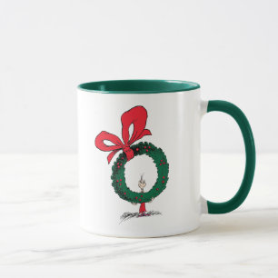 Mug Qui regarde à travers la couronne de Noël