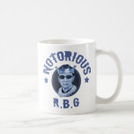 MUG RBG III<br><div class="desc">Ruth Bader Ginsburg dans une couronne & lunettes noires, avec, "Notorious R.B.G" en lettrage en badass. Tons bleus. T-shirts, échange cadeau de nouveauté.</div>