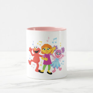 Mug Rue Sésame Julia, Elmo et Abby dansent