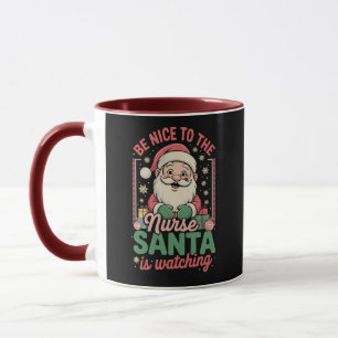 Mug Soyez gentil avec l'infirmière Santa regarde Noël