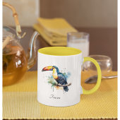 Mug toucan coloré assis sur une branche