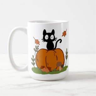 Mug Un chat noir assis sur une citrouille