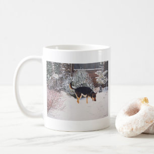 Mug Winter snow scene with cute black and tan dog