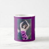 Mug woman in purple sarong , arms raised as if dancing (Centre)