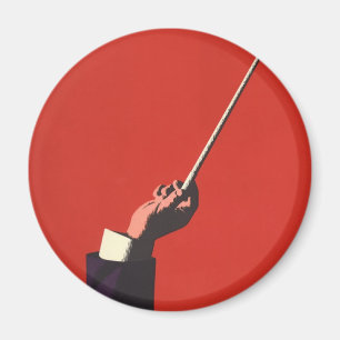 muziek, hand van de geleider die een batterij vas magneet